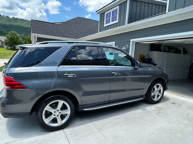Inside Oscar's Mobile Detailing — shop interior and bays